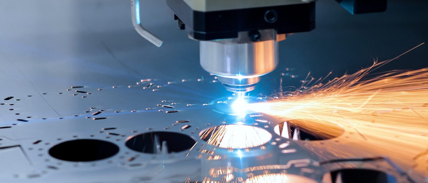 Sheet metal being cut on a CNC plasma or laser cutting machine