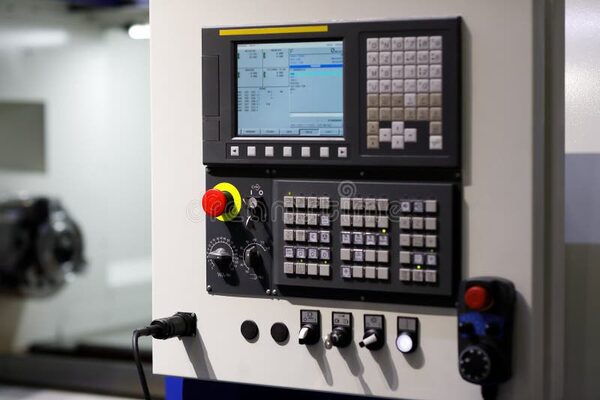 CNC machine control panel with digital display showing real-time data